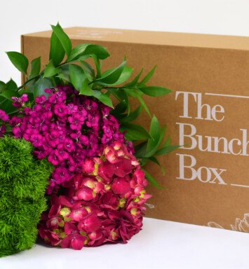 purple flowers & green leaves bunch